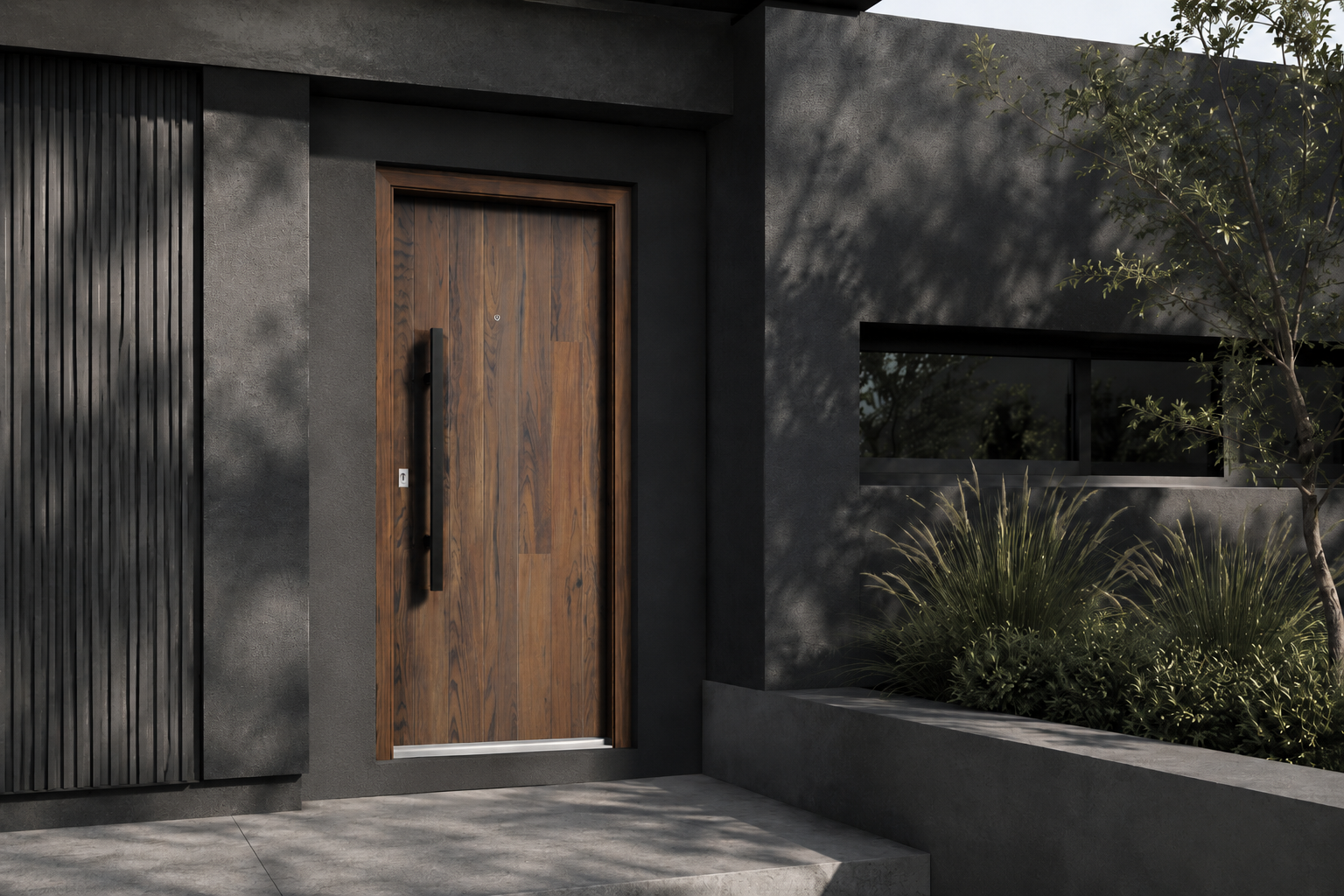 Puerta Pavir Acero Simil Forest 49 instalada en fachada moderna GBA